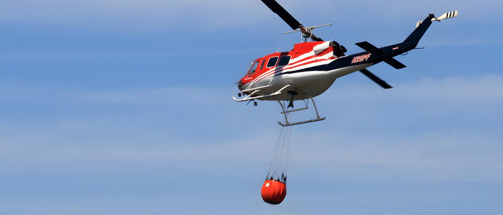 photograph of a helicopter with a cargo hook attached